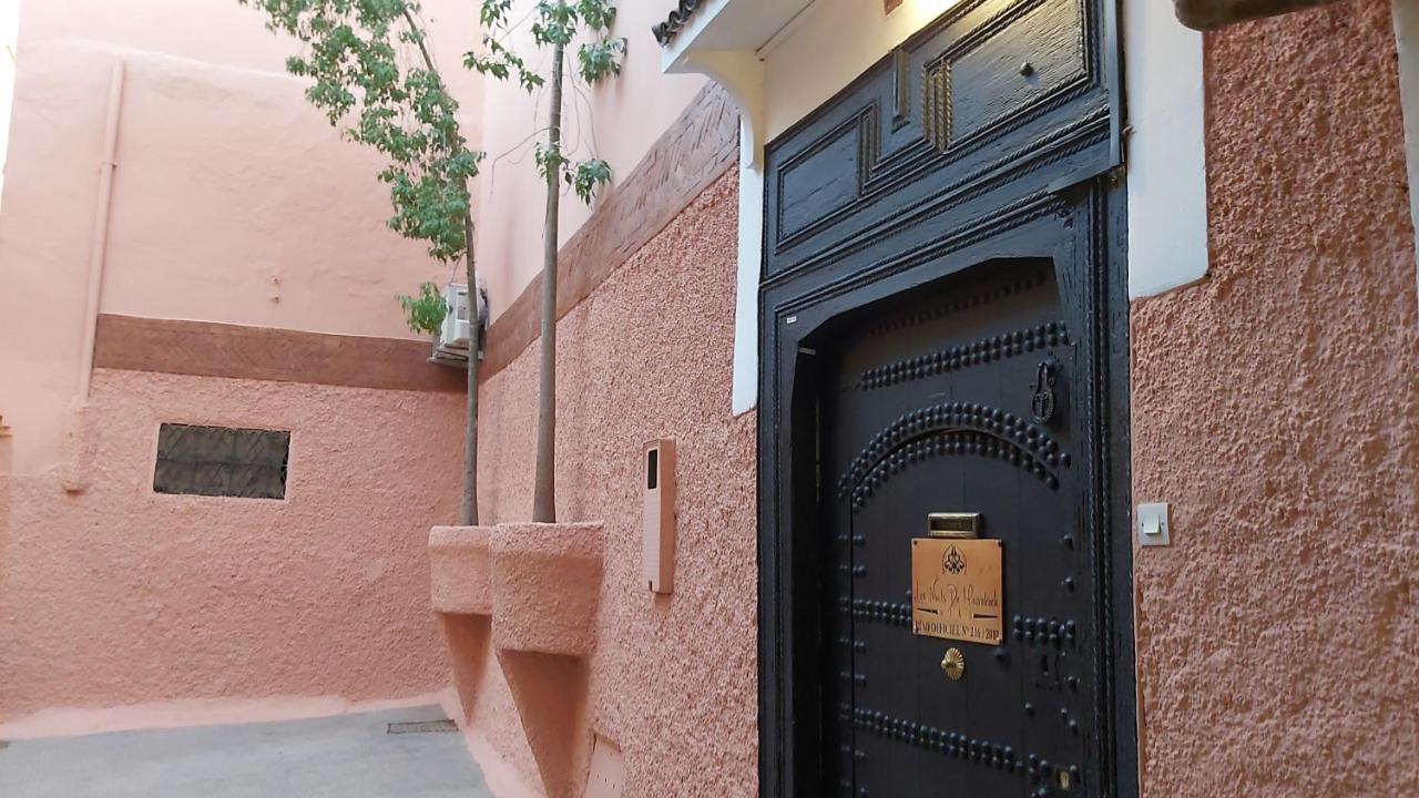 Riad Les Nuits De Marrakech มาร์ราเกช ภายนอก รูปภาพ A door in the medina of Marrakech